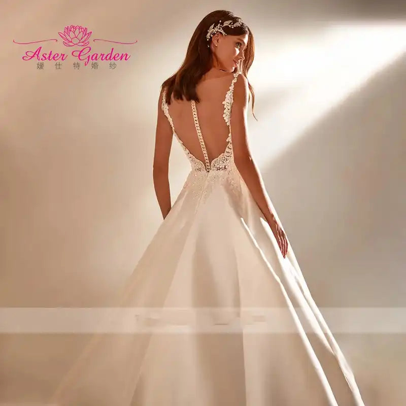 Aster Garden: Glamorous Backless Beaded A-Line Wedding Dress Sleeveless Satin Princess Bridal Gown