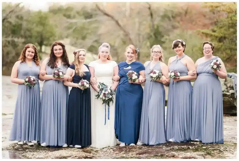 Bridesmaids wearing BABYONLINE Convertible Gowns in navy and grey-blue shades, styled in halter and sleeveless variations for a wedding party.
