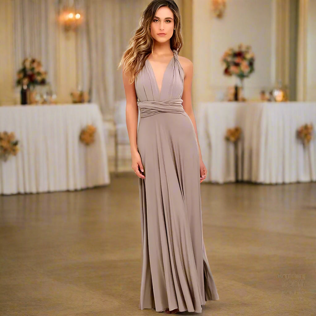 Woman wearing a long, flowing dress against a white background