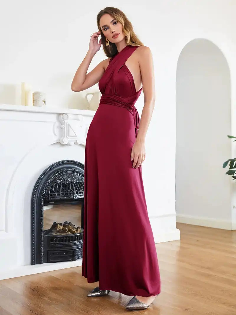 Bridesmaid Dress - Convertible Gown in burgundy by BABYONLINE featuring a sleeveless halter V-neckline and floor-length multiway wrap design. Ideal for weddings or formal events.