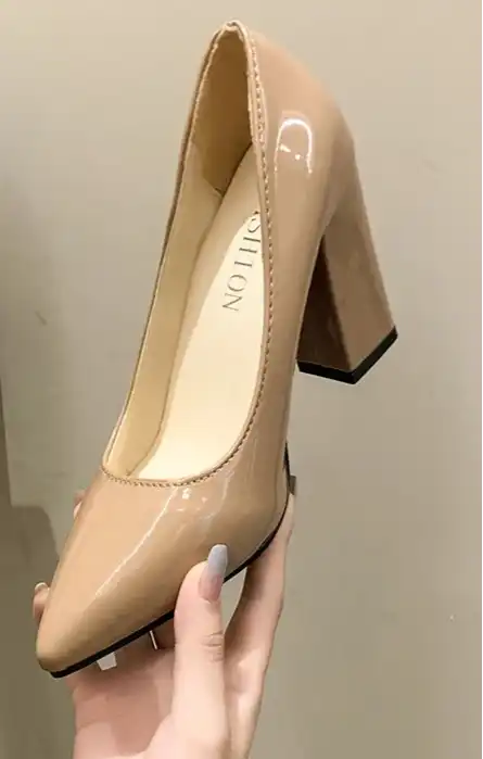 Beige high-heeled shoes held by a hand against a neutral background, with 'Aphixta' branding.