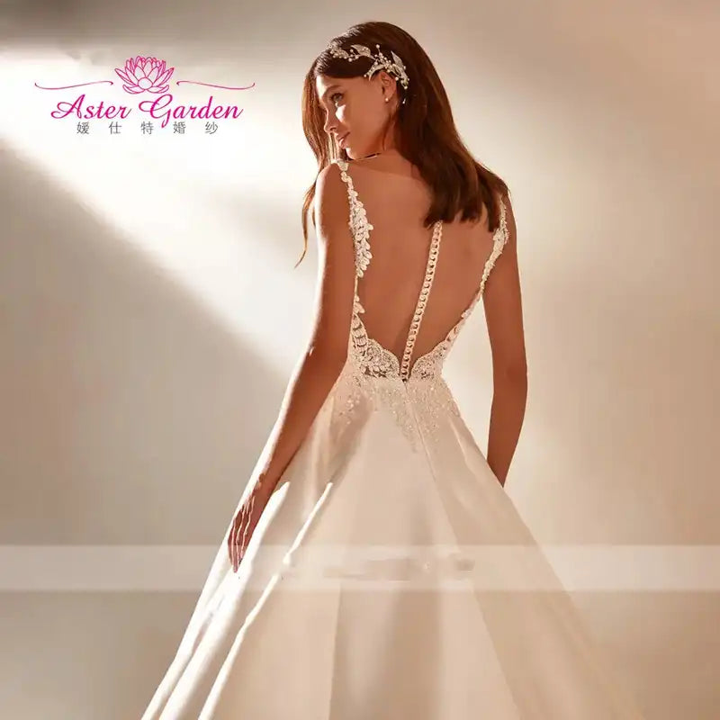 Aster Garden: Glamorous Backless Beaded A-Line Wedding Dress Sleeveless Satin Princess Bridal Gown