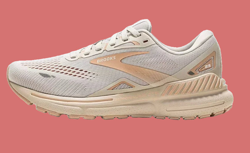 Gray and beige running shoe with 'Brooks' branding on a white background