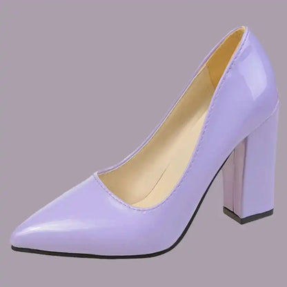 Purple high-heeled shoe on a gray background