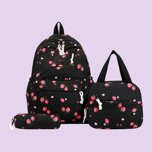 Black backpack with strawberry pattern, matching duffel bag, and pencil case on a white background