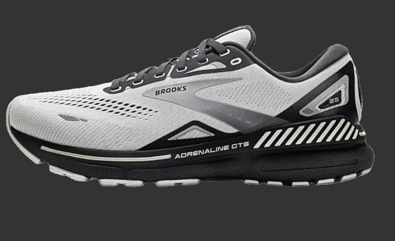 Gray and black running shoe with 'Brooks' branding on a white background