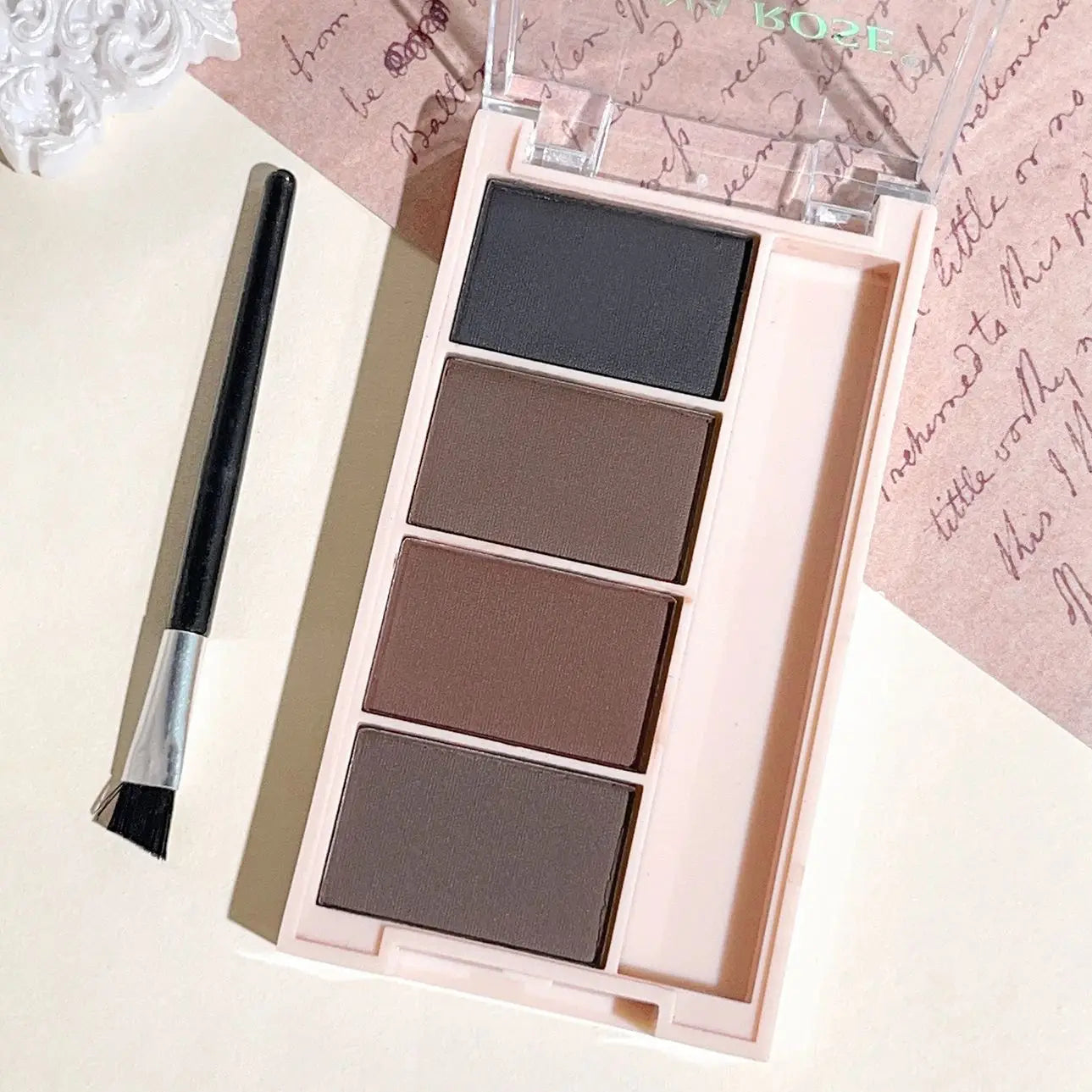 Fashionable, Bold and Beautiful DressA set of 4-color eyebrow powder trays with brushes in gray and brown matte tones for long-lasting color rendering, filling and s